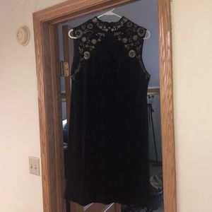 Little black velvet dress with gold details.